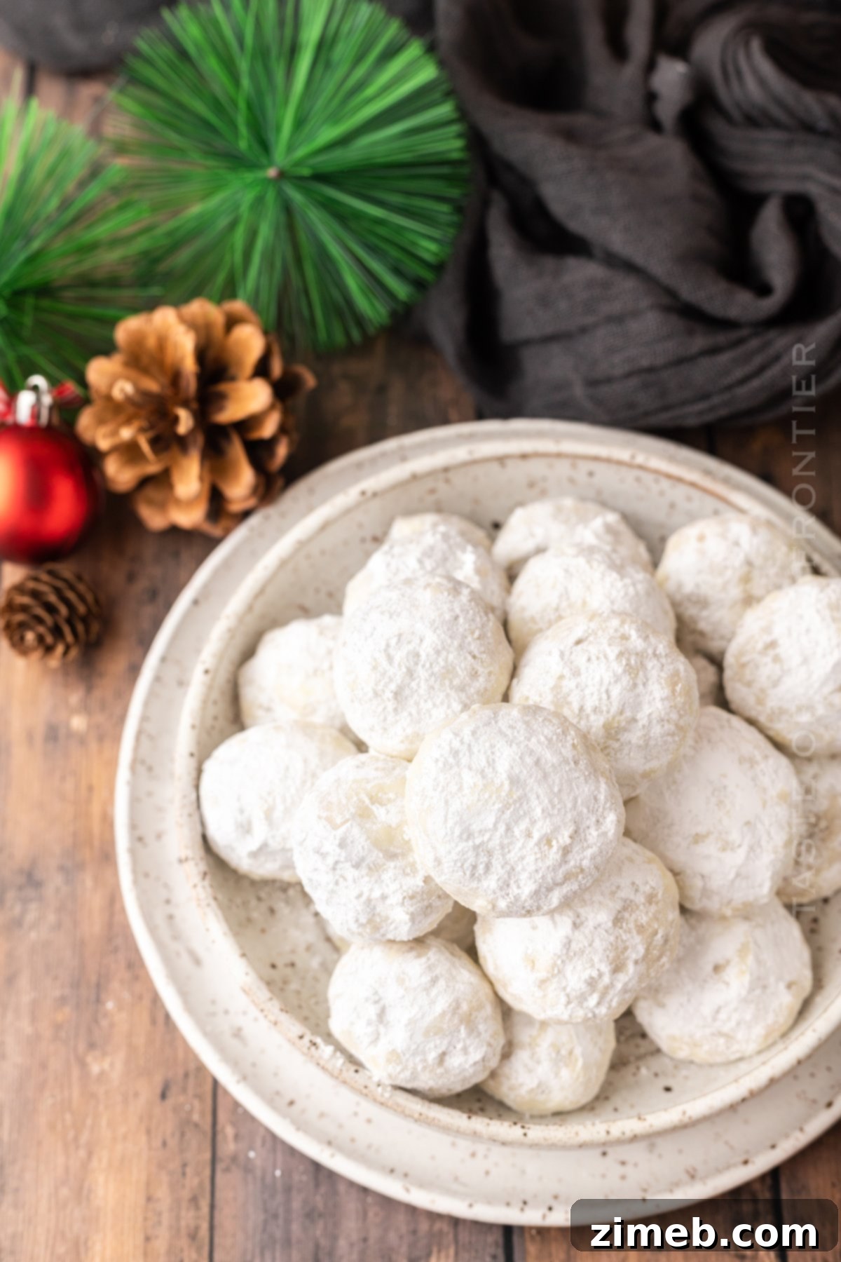 A finished plate of Mexican Wedding Cookies, showcasing their beautiful powdered sugar coating and delicate appearance.