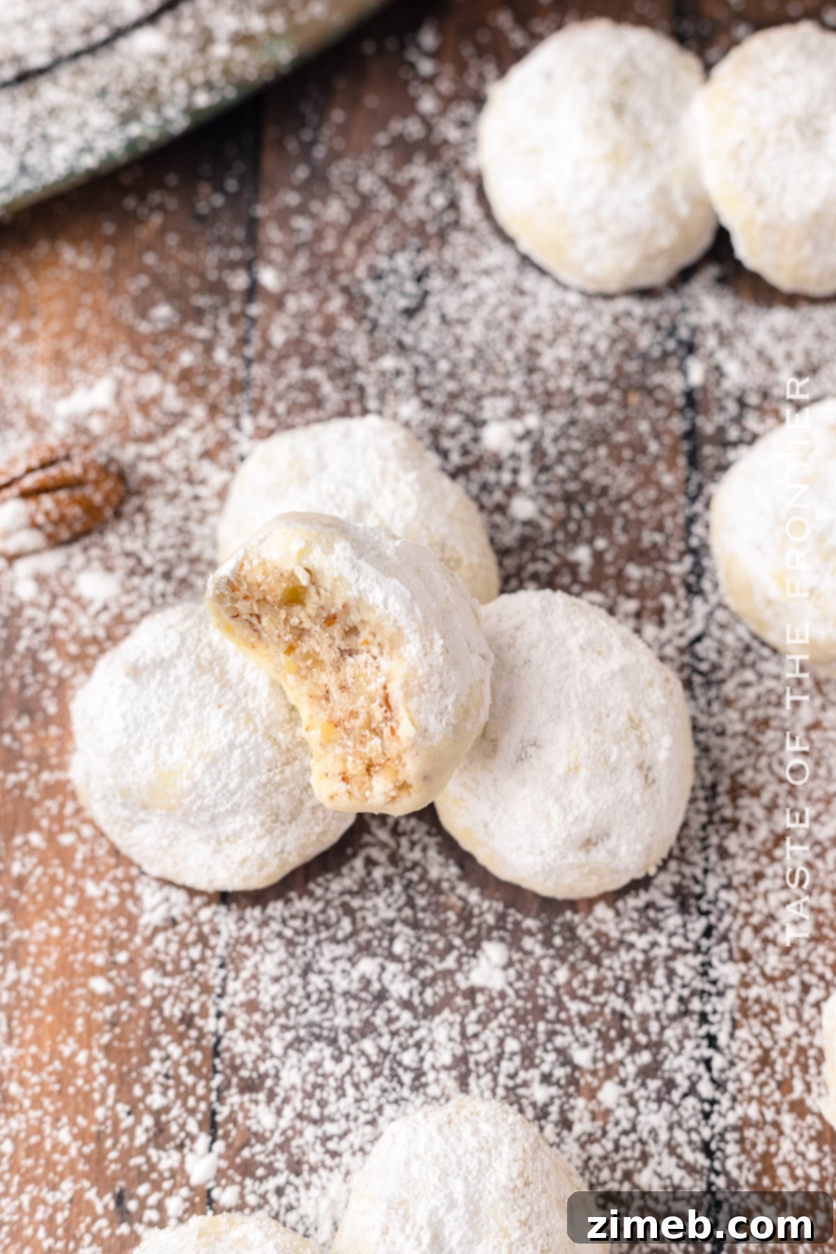 Soft Mexican Wedding Cookies, also known as Russian Tea Cakes, with a delicate powdered sugar coating, perfect for a sweet treat.