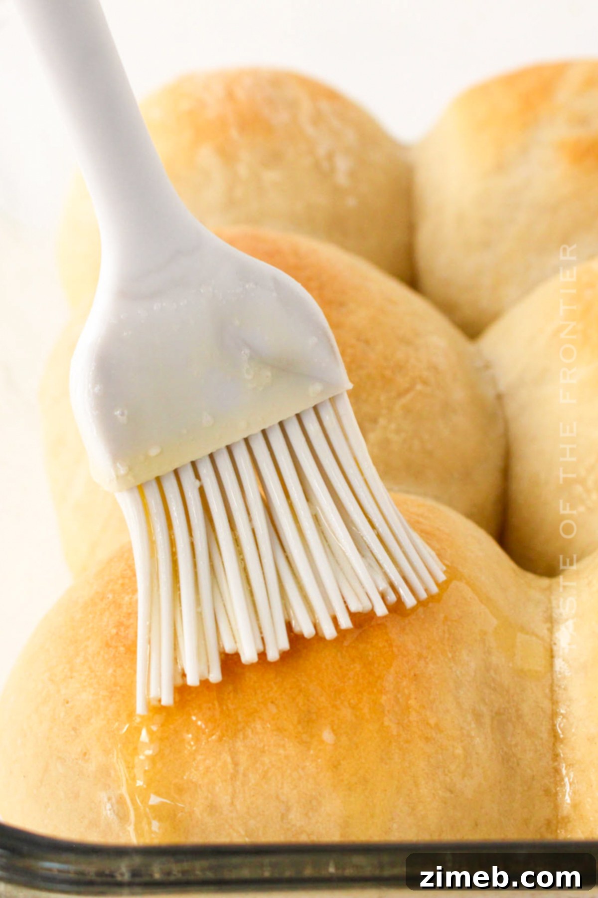 Hands-Off Dinner Rolls 8 adding butter