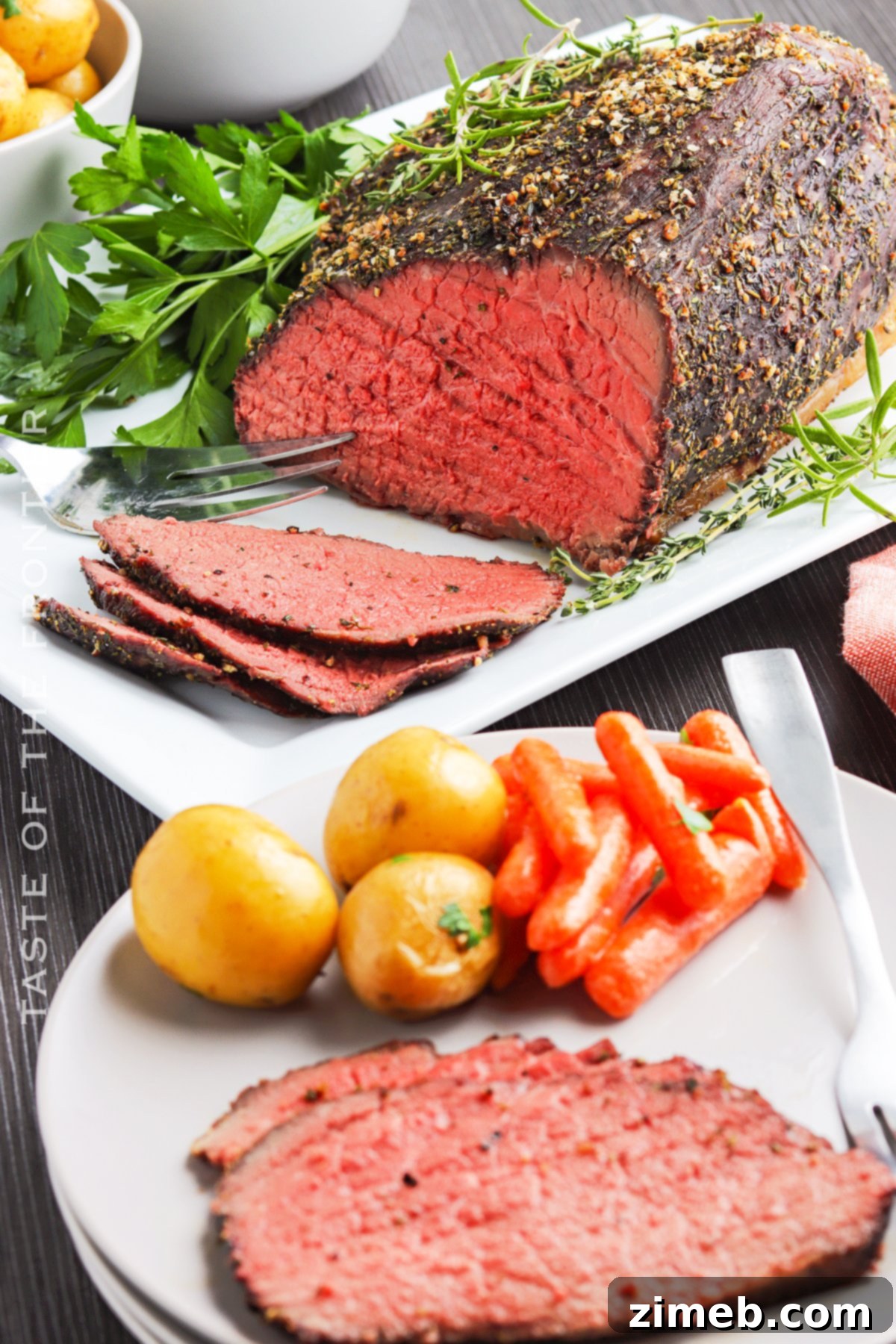 A festive holiday meal centerpiece featuring a succulent oven roast beef, garnished and ready to serve.