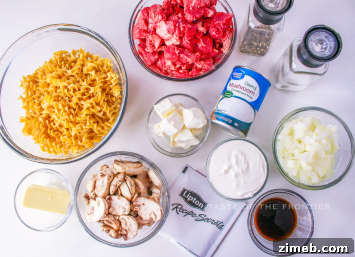 Cozy Comfort Slow Cooker Beef Stroganoff 4 Fresh ingredients for Slow Cooker Beef Stroganoff, including beef, mushrooms, and butter.
