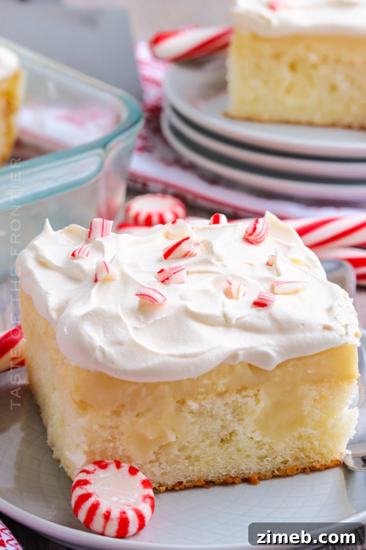 Festive Peppermint Cake 3 Peppermint Cake Dessert, garnished with candy canes