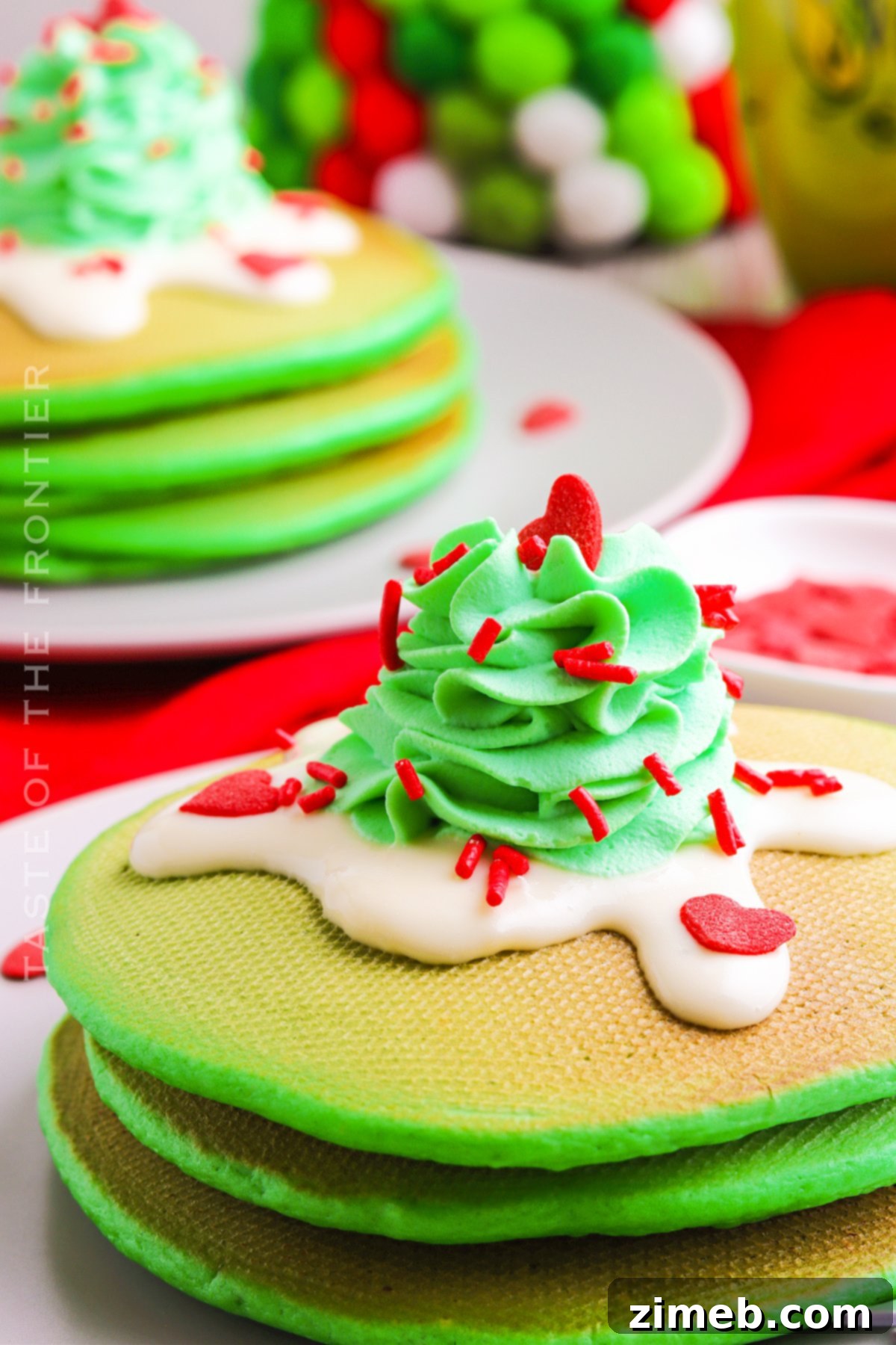 Grinch Green Flapjacks 19 Grinch Pancakes topped with glaze, whipped cream, and sprinkles