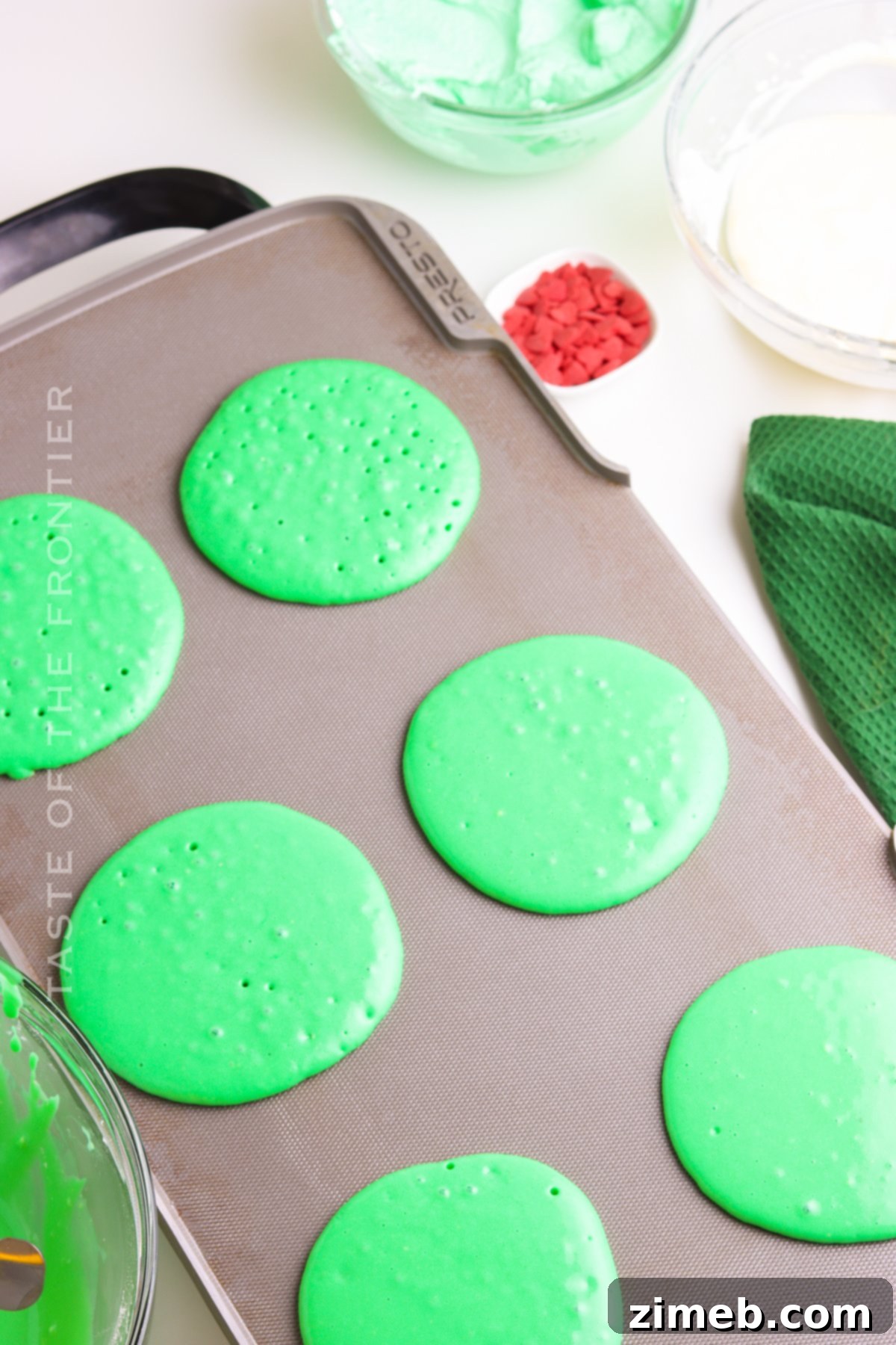 Grinch Green Flapjacks 9 Pancakes cooking on a hot griddle