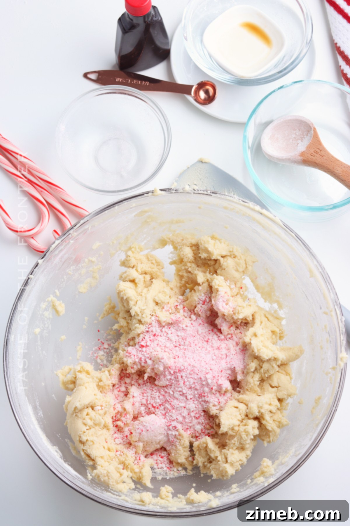 Winter Mint Snowball Delights 7 Adding crushed candy canes to cookie dough