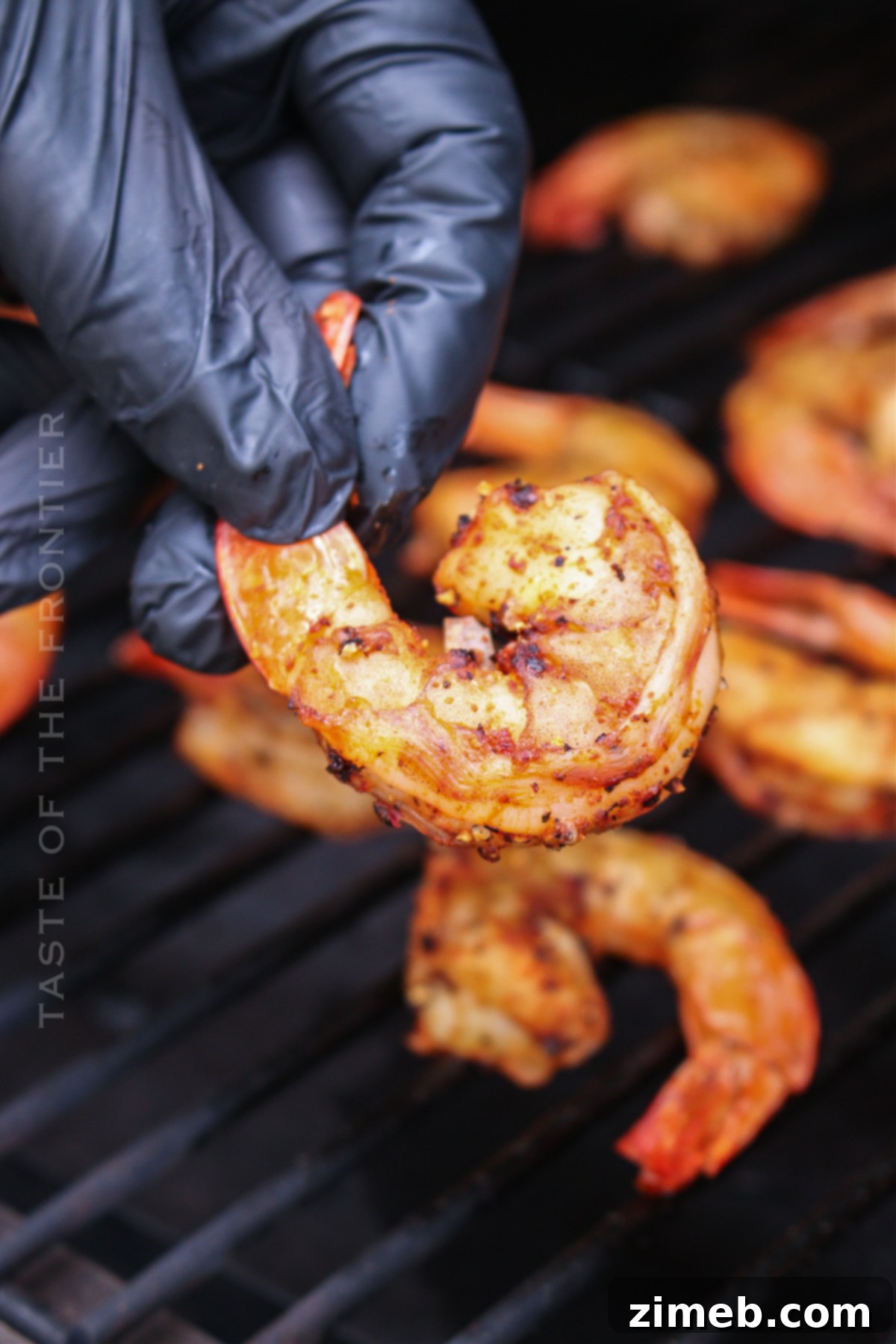 Savory Smoked Shrimp 8 Various seafood, including shrimp, cooking on a pellet grill, showcasing the versatility of the smoker.