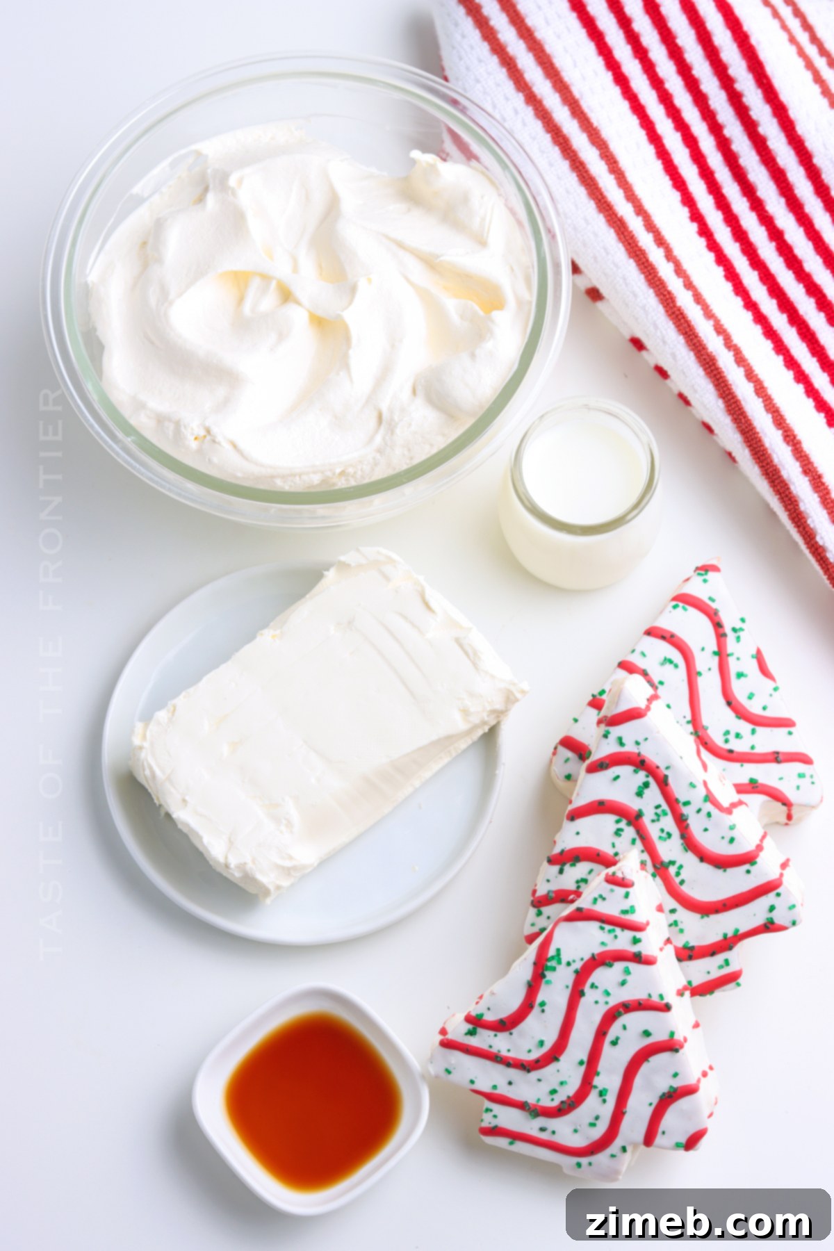 Magical Little Debbie Christmas Tree Dip 4 Ingredients for Little Debbie Christmas Cake dip, including cream cheese, milk, vanilla, whipped topping, and Christmas Tree Cakes.