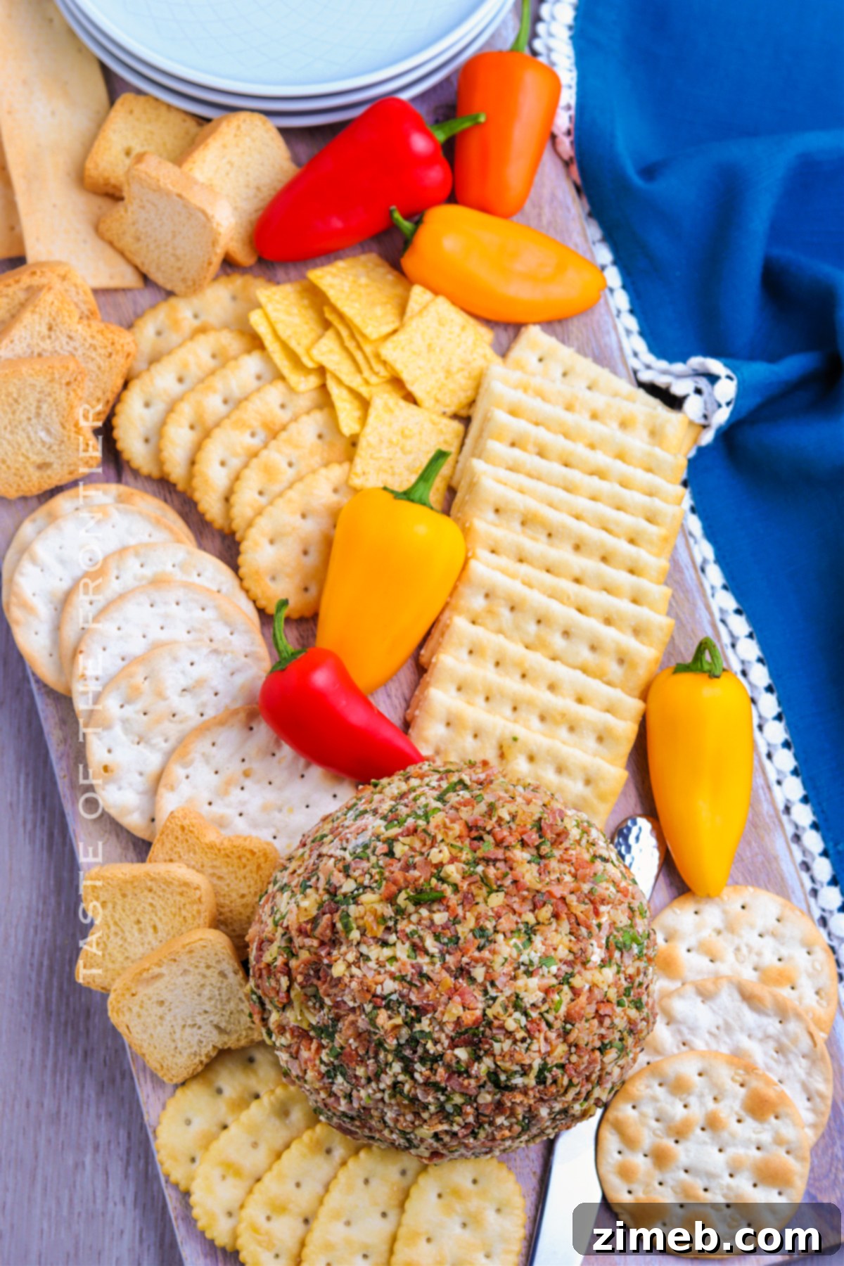 Cheese board featuring a festive cheese ball for parties