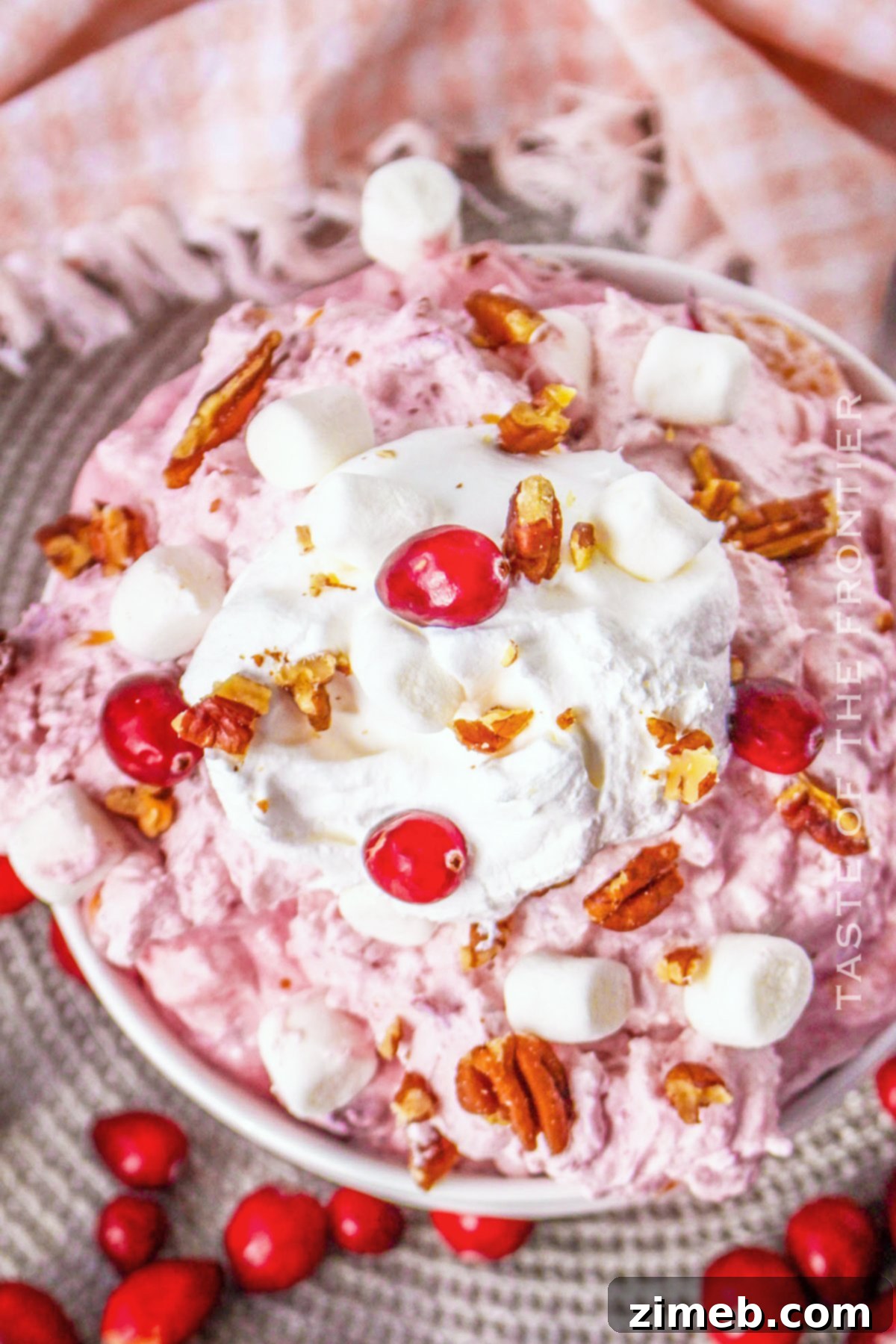 Bright and Flavorful Cranberry Salad 9 Festive Thanksgiving side dish, a creamy cranberry salad in a serving bowl.