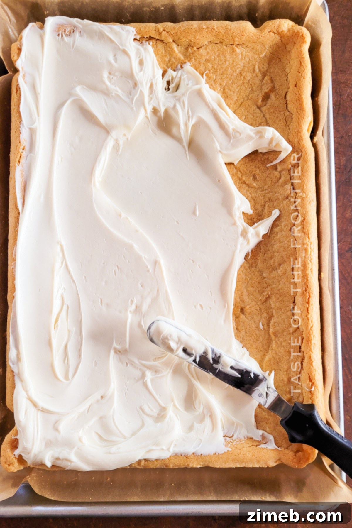 Easy Sugar Cookie Bars 15 Adding frosting to Sugar Cookie Bars