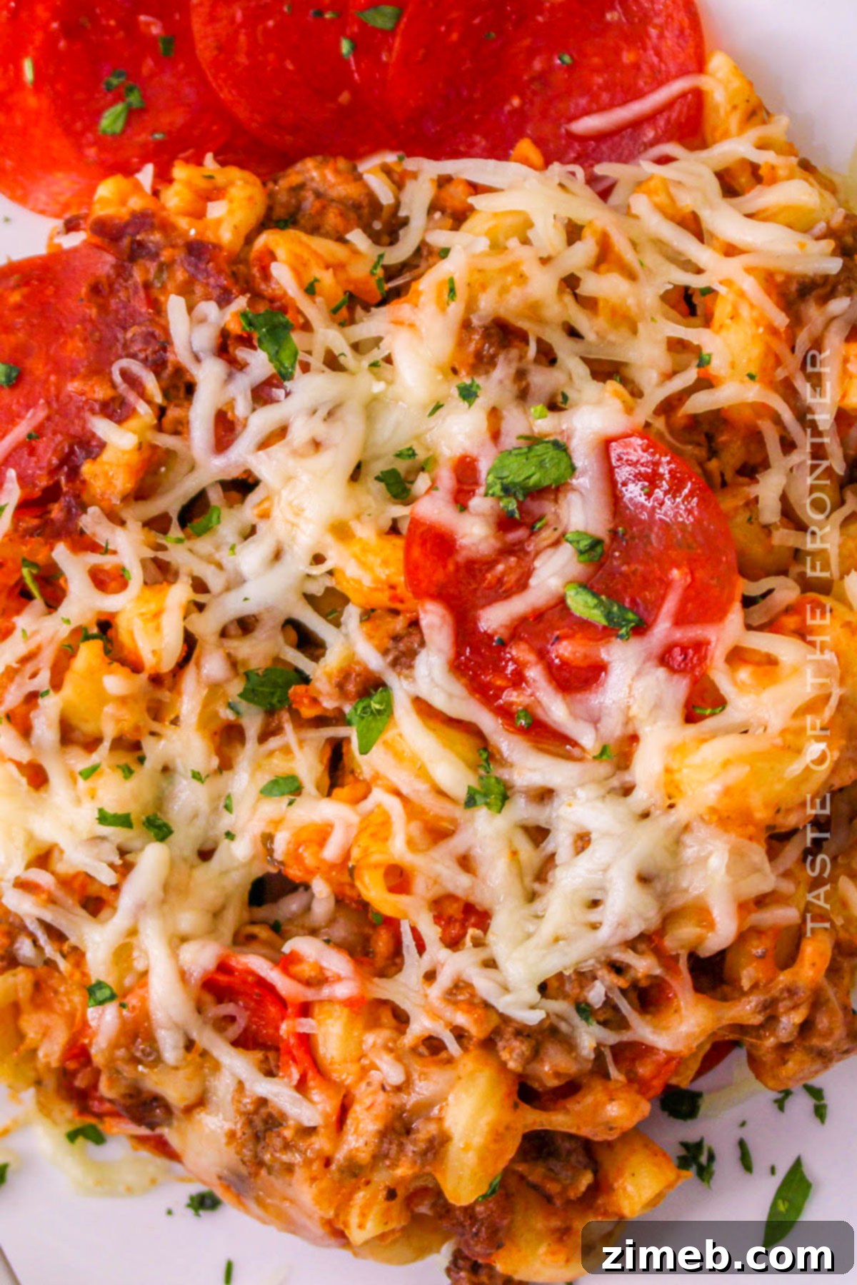 Cheesy Pizza Bake 15 Cooked pasta ready to be mixed into the slow cooker pizza casserole.