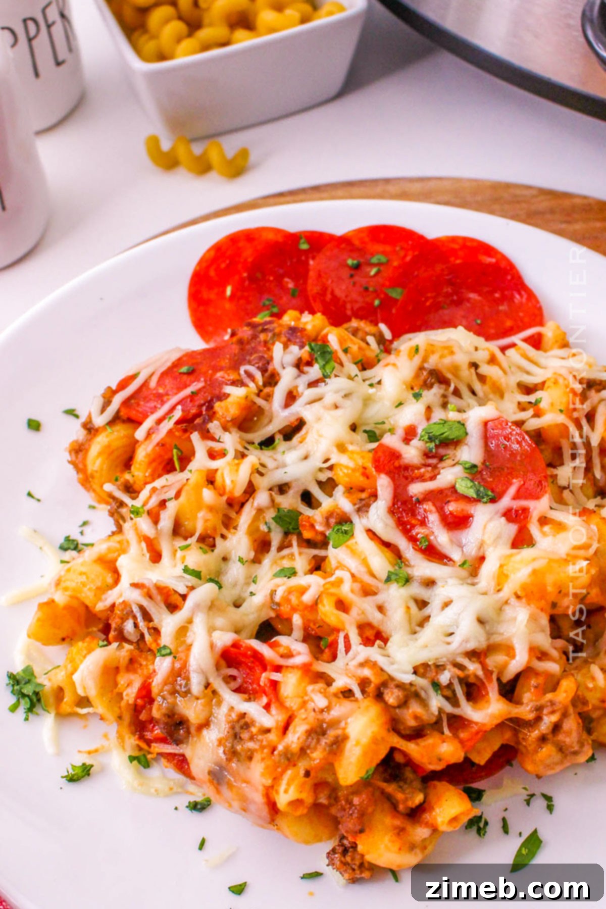 Cheesy Pizza Bake 16 A large serving of slow cooker pasta dinner, showing the rich texture of the casserole.