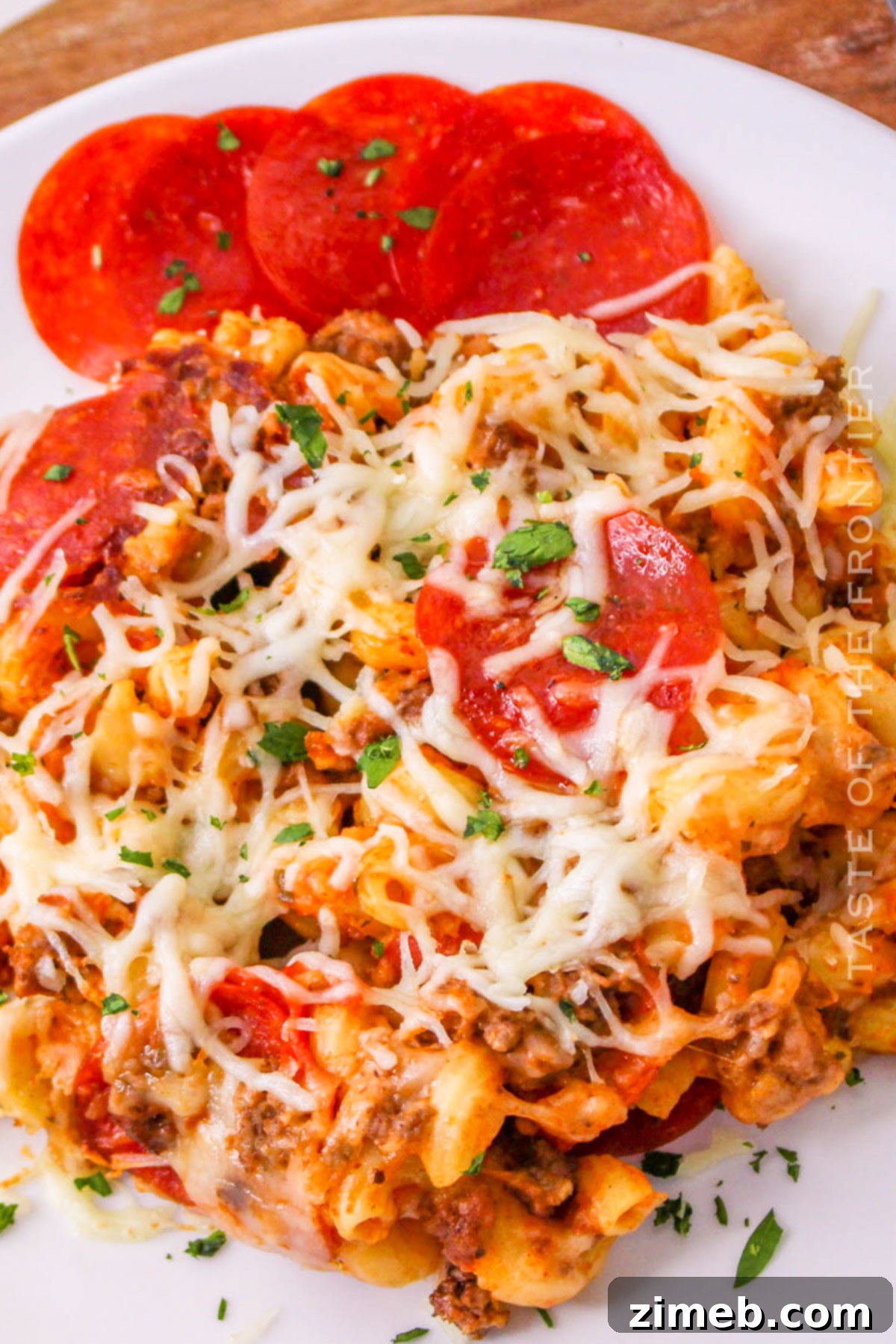 Cheesy Pizza Bake 8 A generous serving of Pizza Casserole made in the Crockpot, presented beautifully.