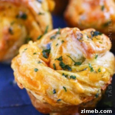 Golden Cheddar Ranch Cruffins, fresh from the oven, showcasing their unique shape.