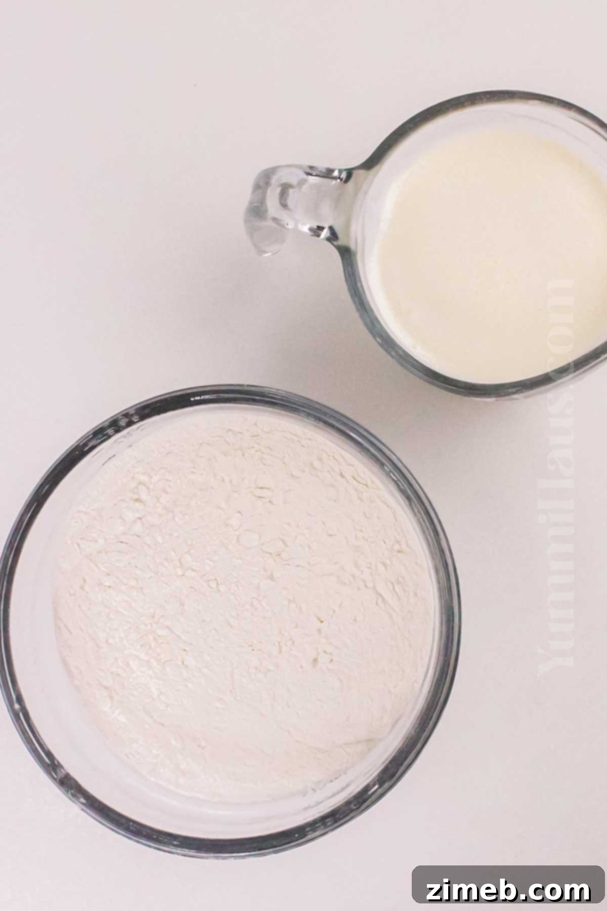 Minimalist Biscuits 4 Two key ingredients for biscuits: self-rising flour and heavy cream, ready for mixing.