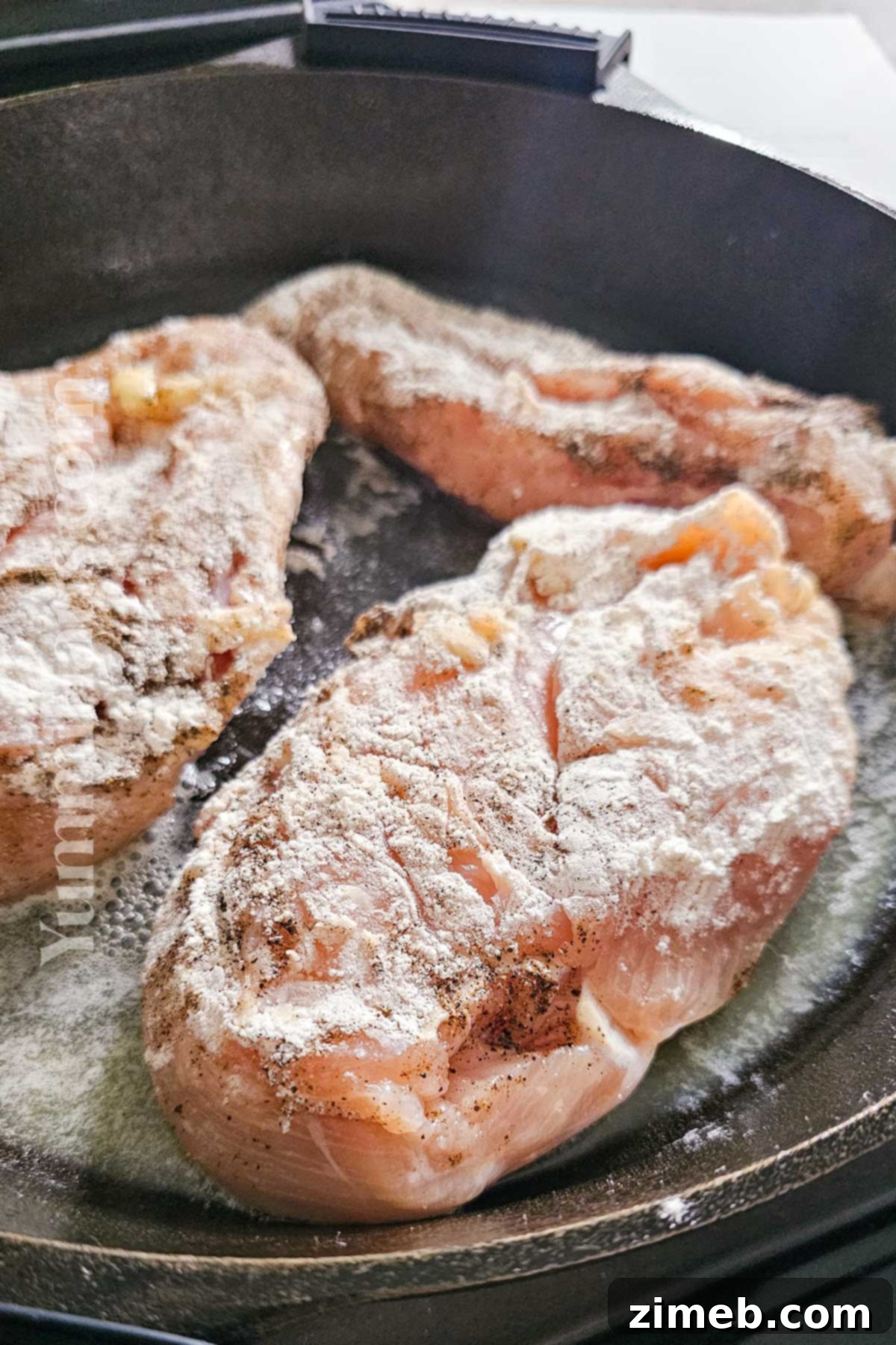 Engagement Chicken 5 Cooking chicken in a skillet for Marry Me Chicken recipe