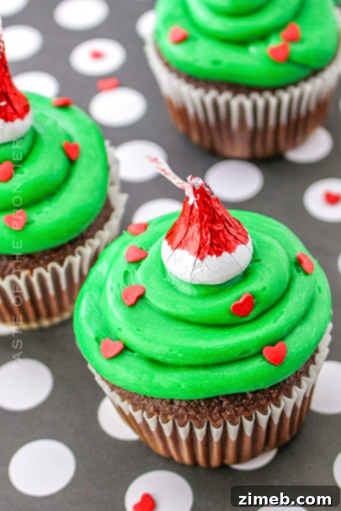 15 Joyful Christmas Cupcake Creations 13 Fun Green Grinch Cupcakes with Red Hearts