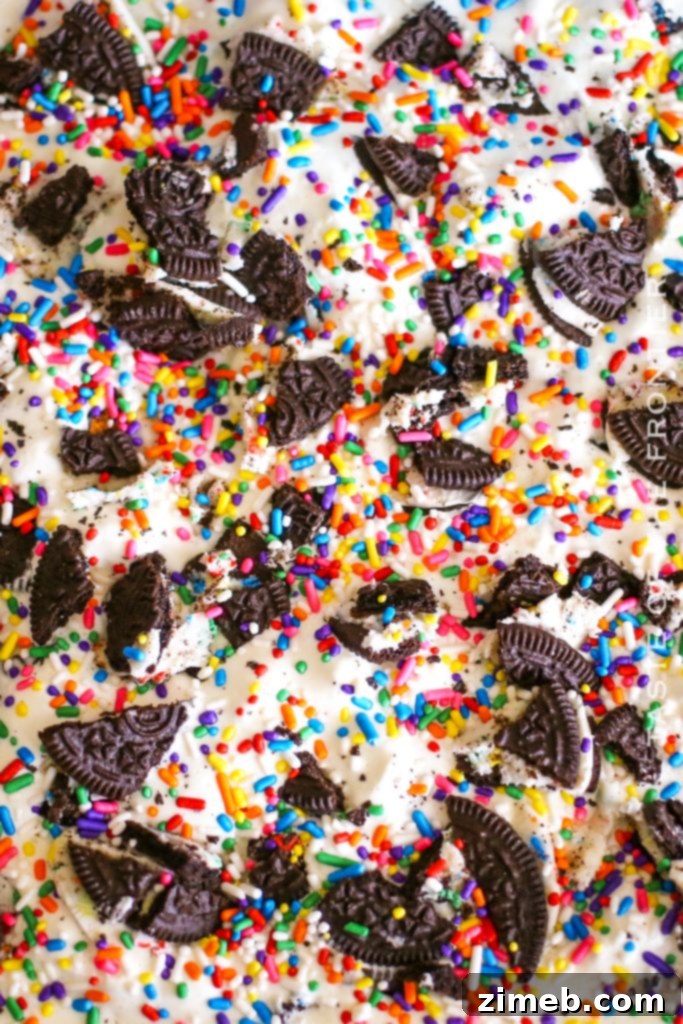 A large tray of Cake Batter Oreo Cheesecake Dessert, ready to be sliced