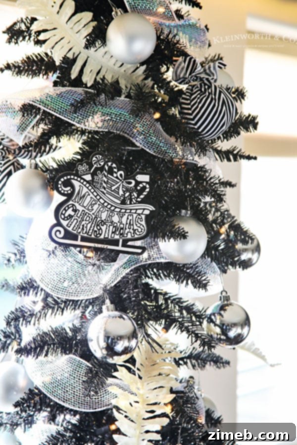 Chic All-Black Christmas Tree with White and Silver Accents