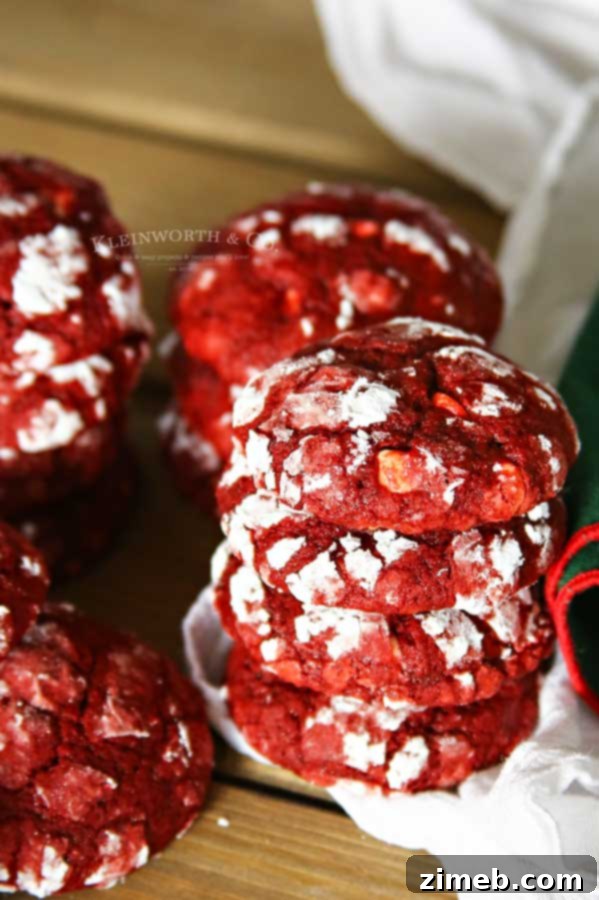 Snow-Kissed Red Velvet Cookies 3 White chocolate chips Red Velvet Crinkle Cookies