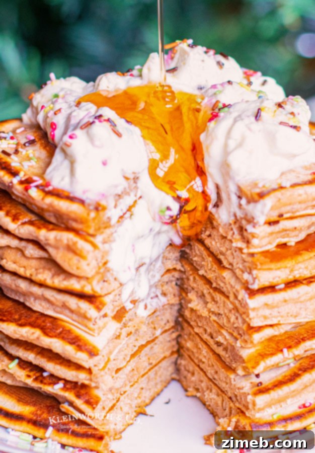 Cozy Gingerbread Flapjacks 17 Pouring syrup on a stack of Gingerbread Pancakes, creating a delicious holiday scene