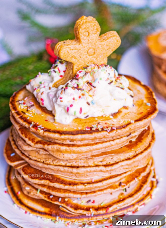 Cozy Gingerbread Flapjacks 3 Fluffy gingerbread pancakes topped with frosting and sprinkles, ready for Christmas breakfast