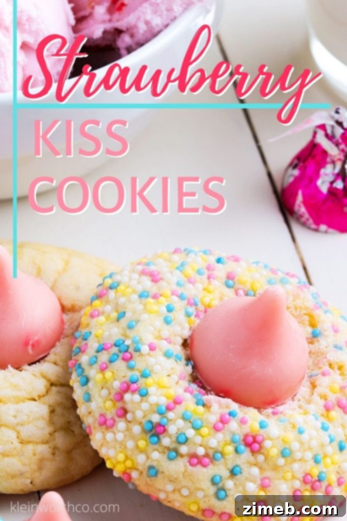 Strawberry Kiss Cookies topped with a melted strawberry Hershey's kiss and pastel sprinkles