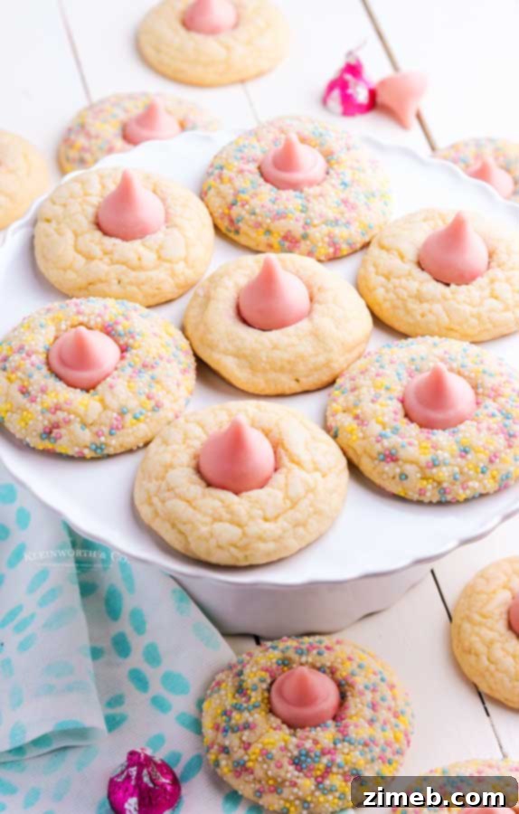 Pretty pink blossom cookies with strawberry Hershey's kisses and a decorative edge