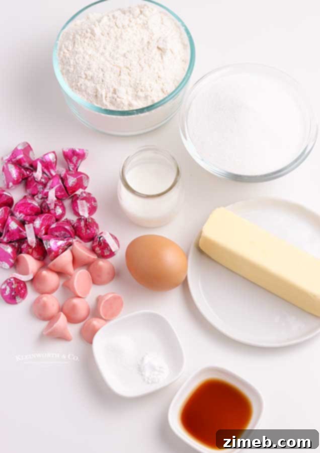 All ingredients for Strawberry Kiss Cookies laid out on a wooden surface