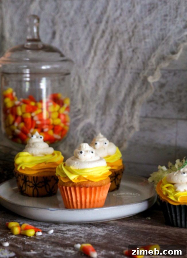 Spooky Ghost Cupcakes 3 Candy corn inspired ghost cupcakes with edible eyes