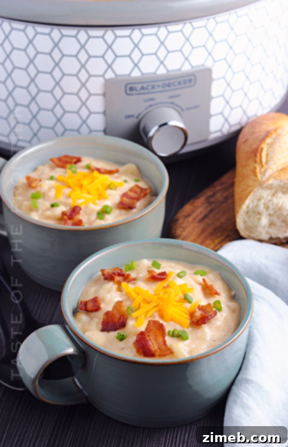 Loaded baked potato soup with all the toppings in a white bowl