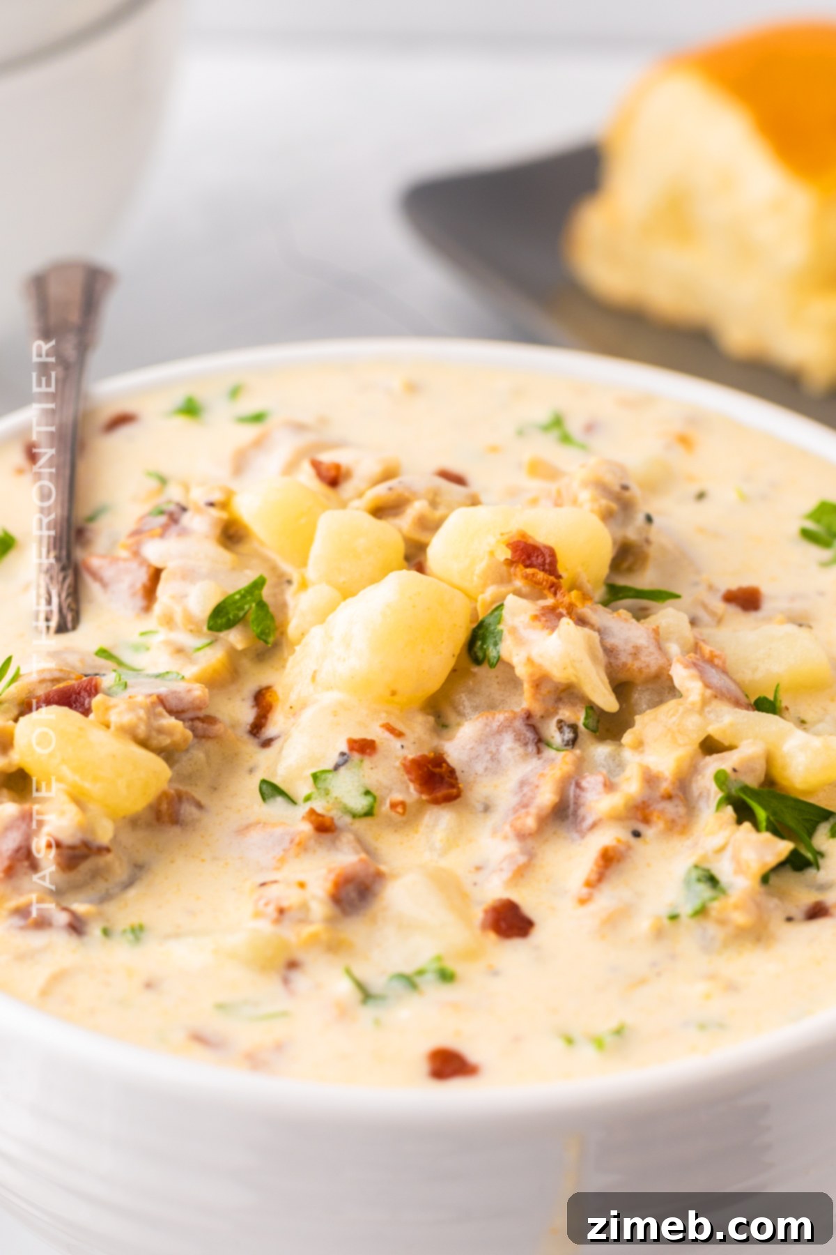 Boston-Style Clam Chowder 19 Comforting dinner recipe: a bowl of creamy New England Clam Chowder with bacon and parsley.