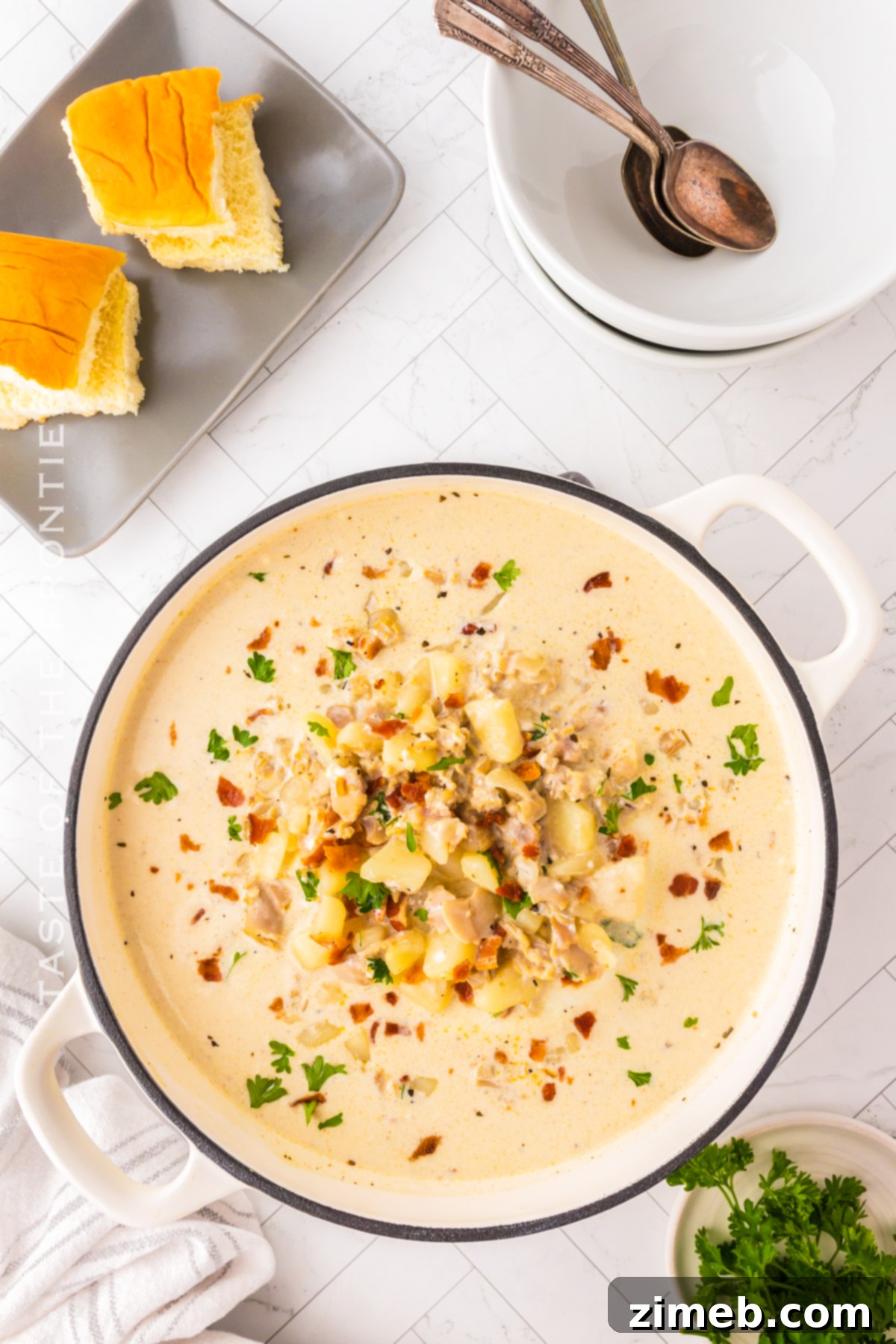 Boston-Style Clam Chowder 8 Delicious and creamy New England Clam Chowder recipe in a bowl with a spoon.