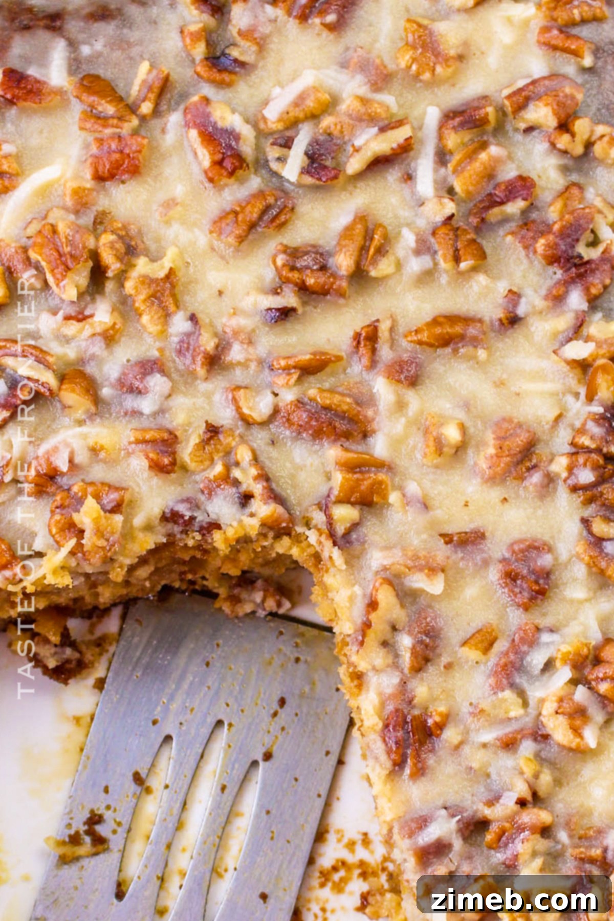 Moist fruit cocktail cake with a generous layer of nutty frosting.