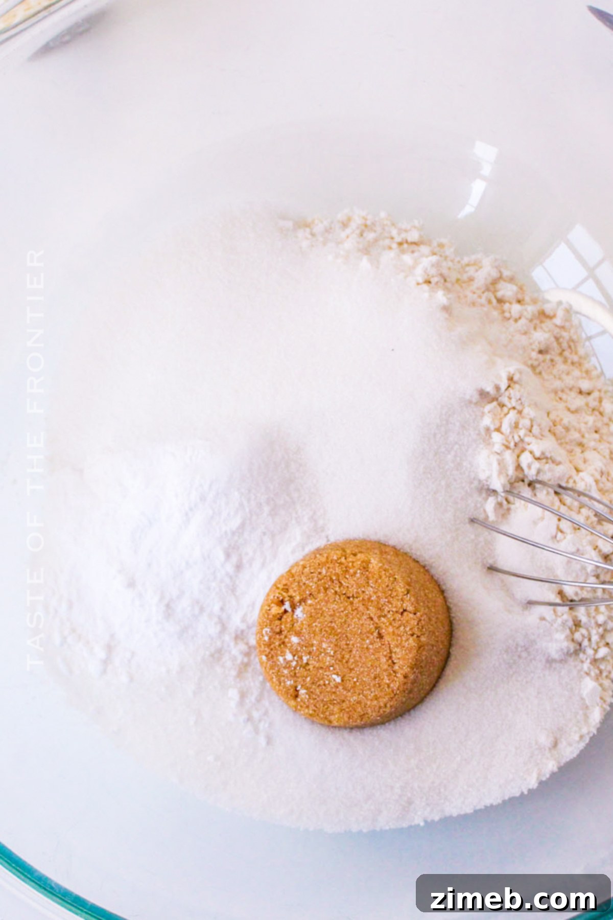 Close-up of dry ingredients for the Fruit Cocktail Cake being mixed in a bowl.